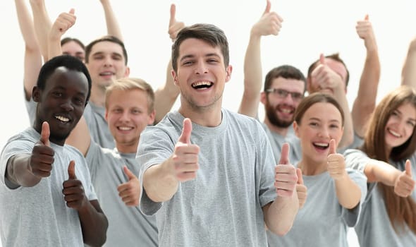 group of young people showing thumbs up.isolated on white