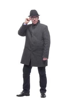 emotional man in a hat and autumn coat . isolated on a white background.