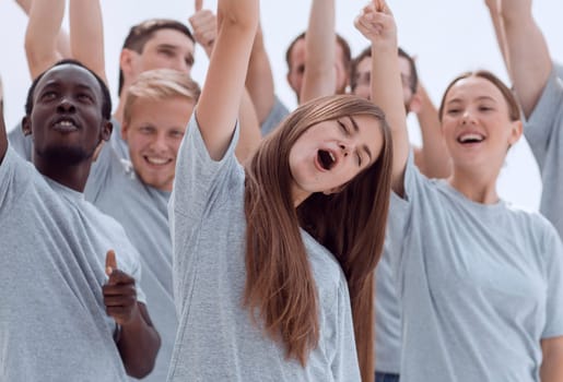 group of happy young people showing thumbs up.isolated on white