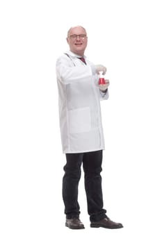 in full growth. qualified mature doctor with laboratory flask. isolated on a white background.