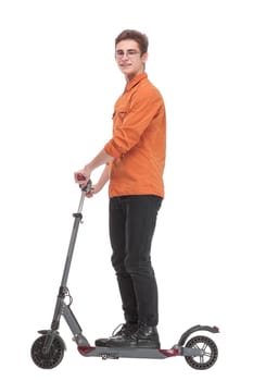 Full length side view portrait of an young man riding a scooter and looking awawy isolated on white background