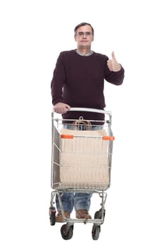 full-length. casual man with shopping cart. isolated on a white background.