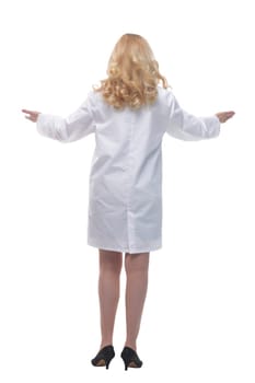 rear view . a woman doctor reading an ad on a large white screen . isolated on a white background.