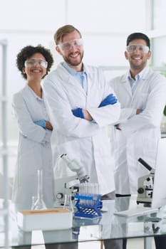 Scientists smiling together in lab