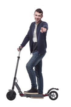 smiling young man with an electric scooter . isolated on a white background.