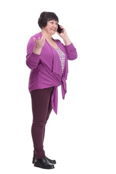 in full growth.casual an elderly woman with a smartphone. isolated on a white background.
