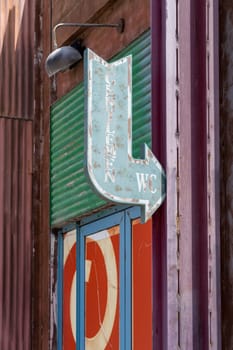 Retro sign for men's restroom in La Mer by the Gulf coast