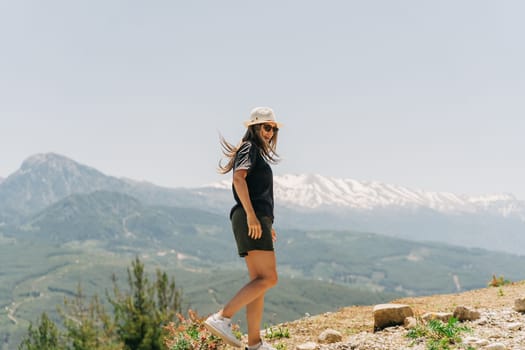 Young woman in hat standing on Mountain View.