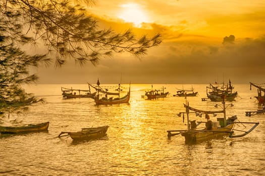 Shaky boats in long exposure photography : Moored boats during sunrise in Satelit Beach Banyuwangi