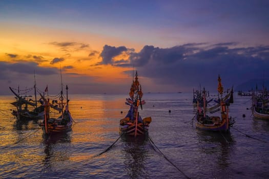 Shaky boats in long exposure photography : Moored boats during sunrise in Satelit Beach Banyuwangi