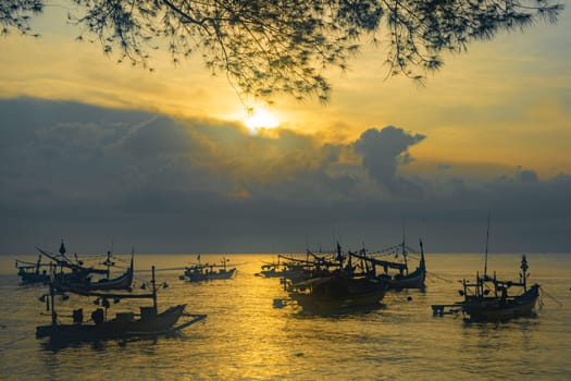 Shaky boats in long exposure photography : Moored boats during sunrise in Satelit Beach Banyuwangi