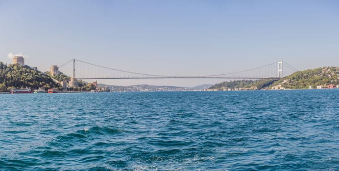Turkey, Istanbul, houses below Fatih Sultan Mehmet Bridge on Bosphorus Strait.