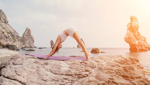 Fitness woman sea. Outdoor workout on yoga mat in park near to ocean beach. Female fitness pilates yoga routine concept. Healthy lifestyle. Happy fit woman exercising with rubber band in park.