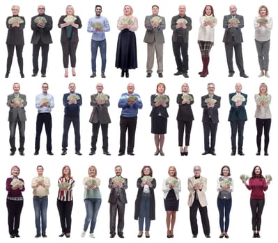 group of successful people with money in their hands looking at the camera on a white background