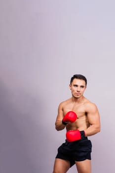 Training, young man and boxer with boxing gloves for a competition, prepare for match