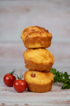 Savory muffin with ham and cheese on blue background, High quality photo