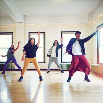 Talent that will take them to the top. a group of young people dancing together in a studio
