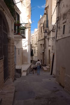 Narrow street of Vieste old town Apulia region, Italy