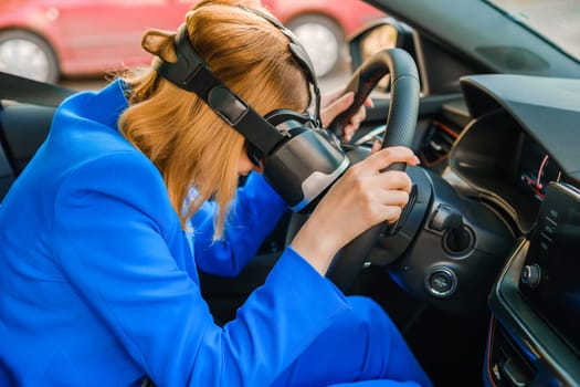 Business woman in the VR googles sitting in the car and put her head on the steering wheel. Game over in augmented reality in the metaverse world.