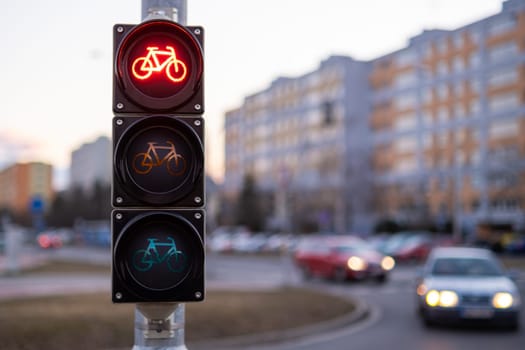 Traffic red light forbids bicycles to pass in public place.
