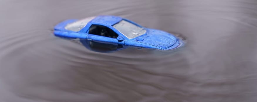 Natural disasters. The car was flooded by floods. One of them is out of focus.
