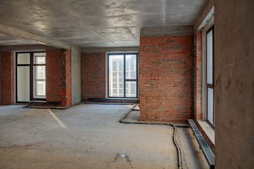 Repair and restoration of apartments. Red brick walls, concrete floors