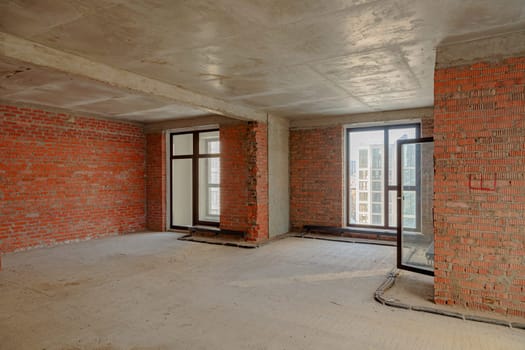 Repair and restoration of apartments. Red brick walls, concrete floors
