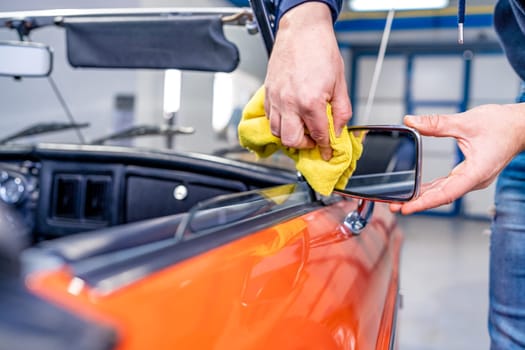 manual cleaning of the interior of an old car. High quality photo
