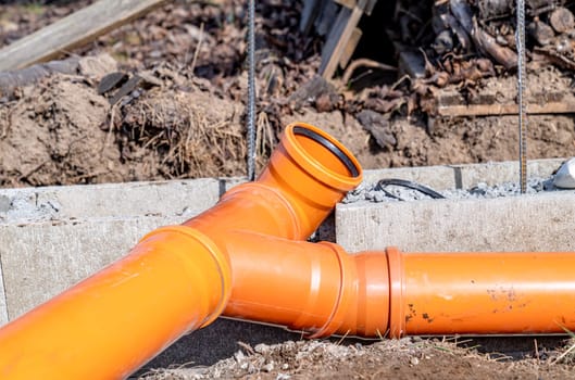 PVC plastic pipe for sewerage in the ground.