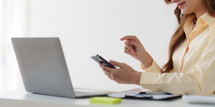 Beautiful American woman completes KYC using an online banking program in order to open a digital savings account. The definition of cyber security.