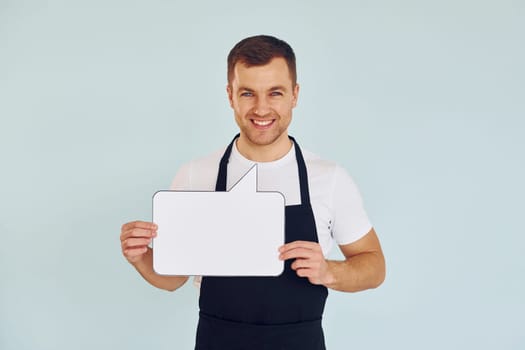 Sincere emotions. Man standing in the studio with empty signs for the text.