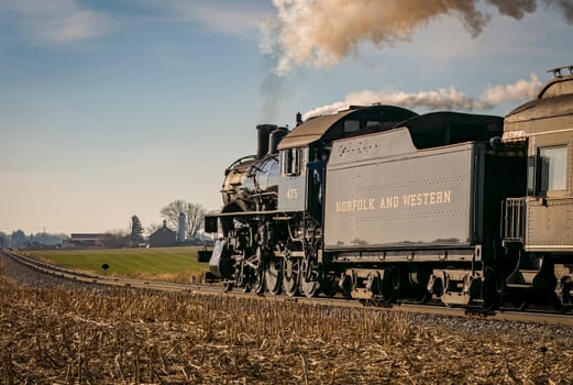 Ronks, Pennsylvania, December 30, 2022 - A Rear Close Up View of a Classic Steam Locomotive Traveling Thru the Countryside