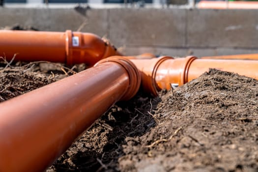 sewage system made of plastic PVC pipes in the ground.