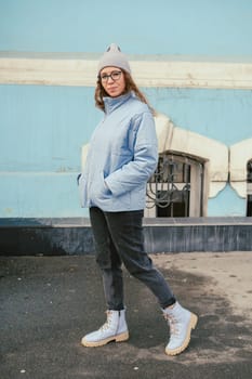 Portrait of a stylish woman in blue jacket. Spring outdoor portrait.