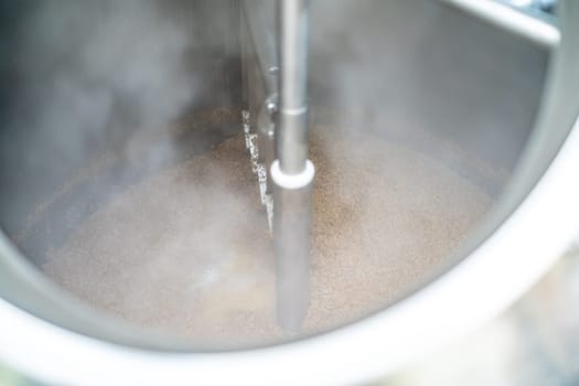 stainless steel boiler for brewing beer in a brewery. High quality photo