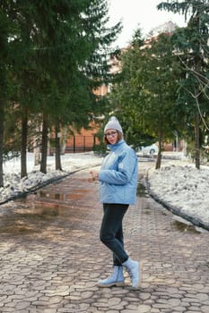 Portrait of a stylish woman in blue jacket. Spring outdoor portrait.