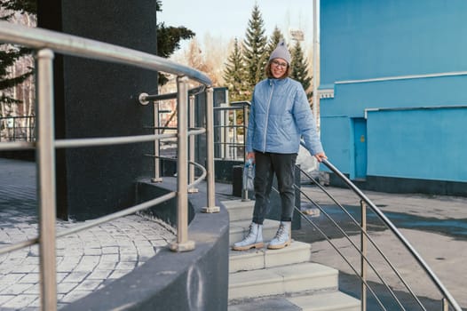 Portrait of a stylish woman in blue jacket. Spring outdoor portrait.