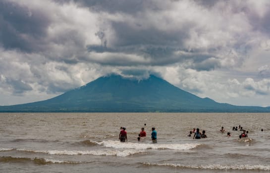 Group of people enjoying in Lake Nicaragua. Nicaraguan vacationers enjoying in lake Ometepe, Nicaragua.