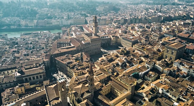 Aerial view of famous tower and Palazzo Vecchio square and Florence cityscape, Italy. High quality photo