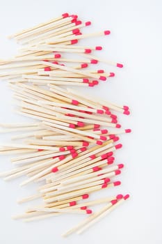 Long matches with a red head on a white background. Kitchen, ignition, gas, flammable