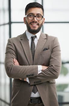 portrait of confident businessman with arms crossed