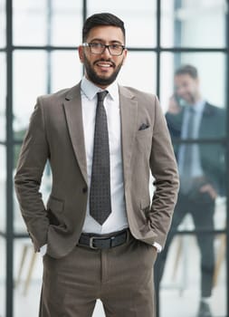 portrait of confident businessman with arms crossed