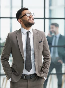 portrait of confident businessman with arms crossed