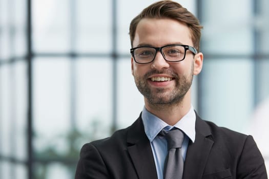 Close up photo portrait of successful and happy businessman working in modern office building, senior investor