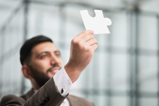 People holds in hand a jigsaw puzzle. Business solutions, success and strategy.
