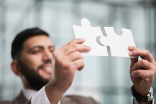 People holds in hand a jigsaw puzzle. Business solutions, success and strategy.