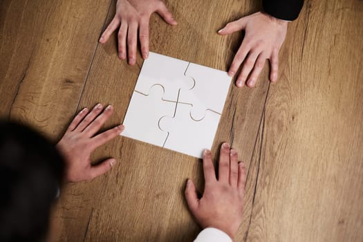 Above view of businessman looking at paper during meeting before signing it
