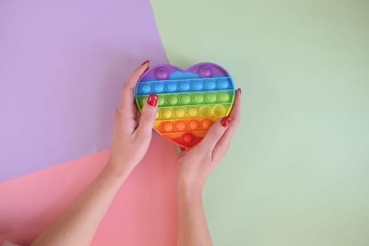 Push pop bubble sensory fidget toy stress. Background with three colors.