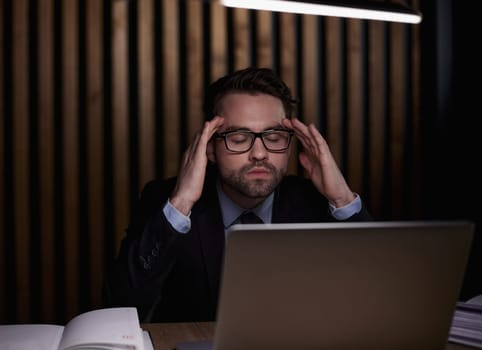 You shouldnt have to think twice about going online. a handsome young businessman sitting behind his laptop in his office.