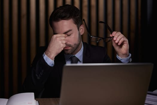 stressed man suffer from headache bad vision sight problem sit at home table using laptop